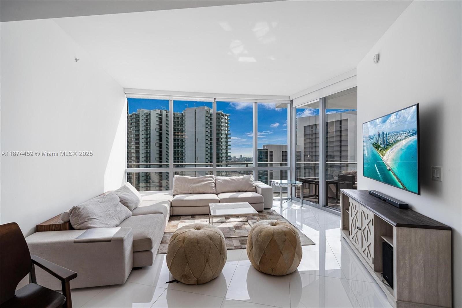 Welcome to the absolute most stunning 2bed/3bath + den with enclosed direct water view furnished on one of the highest floors with rare huge wrap around terrace at Paramount Miami. Features include: private elevator, direct water view, huge terrace, floor to ceiling windows, 10 ft high ceilings, white tile floors, marble backsplash, gourmet kitchen w/Bosch and Sub Zero appliances, split floor plan, huge master bathroom w/sunken tub & shower, large walk in closet, enclosed den, washer/dryer area, spacious second bedroom with private bathroom + terrace. Nicely furnished with l shape sofa, tons of patio furniture, king bed, TV, dining table,, trundle bed in den and more. Have access to world class amenities: basketball, tennis, 5 pools, boxing, spa, gym, shopping and more.