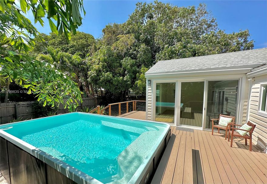Your charming West Palm Beach bungalow with a Pool awaits! This light-filled 3-bed, 2.5-bath home blends classic character with modern flair. Tropical landscaping and a dreamy pergola-covered porch sets the tone. Inside, enjoy an open kitchen with island seating, that flows into spacious living and dining areas. The primary offers French doors that lead to a large deck, heated pool, and your Mango tree. Oversized sliders create that seamless indoor/outdoor lifestyle; perfect for entertaining and soaking in the South Florida vibes. This gem was recently renovated; clean and ready for your personal touch. Ideally located—only 5 minutes to Downtown West Palm Beach, steps to Safe Harbour Rybovich Marina, 10 minutes to The Breakers, and close to everything Worth getting to.