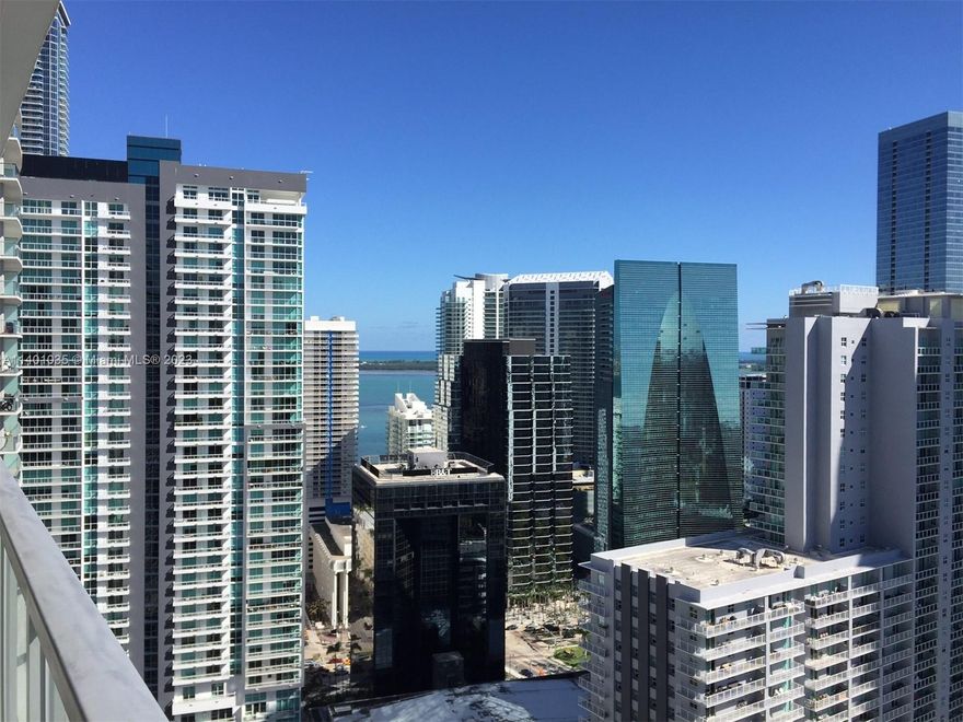 LOWER PENTHOUSE (38th floor) large 2/2 split plan with great views!  INCLUDES tandem pkng (2 spaces).  Ceramic in main areas/carpet in bdrms; floor to ceiling windows; full size W/D; lg balcony overlooking Biscayne Bay, pool, Brickell & sunsets.  S/S & granite kitchen.  Next to MetroRail/shops/restaurants.  Great bldg-amenities: 2 pools, jacuzzi, spa, full gym, media room, security, concierge & valet pkng.  Rent includes water/trash.  Easy condo application-$100 fee per tenant/fast approval.  Proper documentation to be submitted with offer. TEXT L/A for more information.  YEARLY LEASES ONLY.