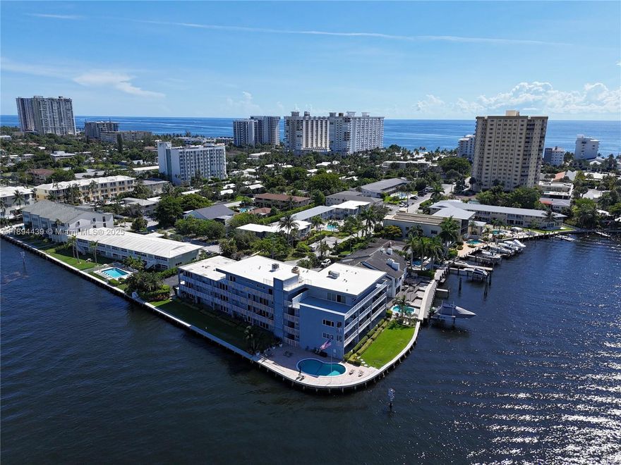 Breathtaking Waterfront Living! Enjoy stunning views of the Intracoastal and Lake Santa Barbara from this beautifully updated, professionally decorated coastal-inspired residence. Located in a boutique building on a wide-water point lot, this light-filled unit captures the essence of Florida living.

Inside, the open kitchen features white cabinetry, stainless steel appliances, and a spacious island perfect for cooking and entertaining. The bathroom has been tastefully renovated with a glass-enclosed shower, modern vanity, and ample storage.

Relax by the heated waterfront pool as boats parade along the Intracoastal. Just two blocks from the beach and close to the shops and restaurants of vibrant new Pompano Beach.  Ideal as a vacation retreat or full-time residence.