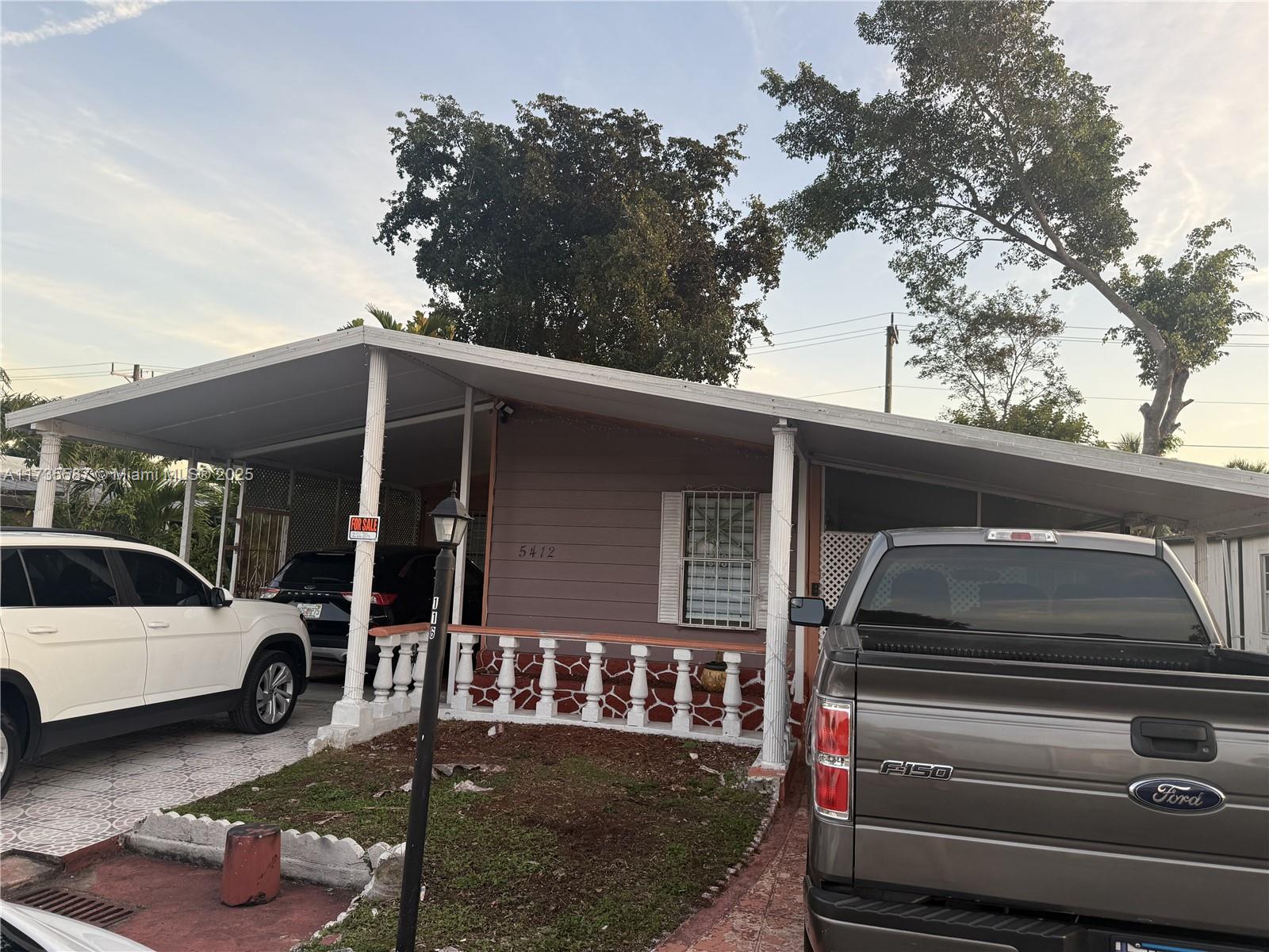 Beautiful and spacious double wide manufactured home with a NEW ROOF! 4 Huge bedrooms with 2 very large bathrooms! A side bedroom has potential for in law quarters. Remodeled kitchen with new high quality appliances. This home is ready for an extended family. Backyard can host friends and family throughout the year with ease and the covered front lenai is great to sit on the front porch on those rainy Miami days. Seller will also repaint interior and exterior of the home before closing. Mini split AC in every room (better on electrical costs and extremely comfortable/ bring a sweater).