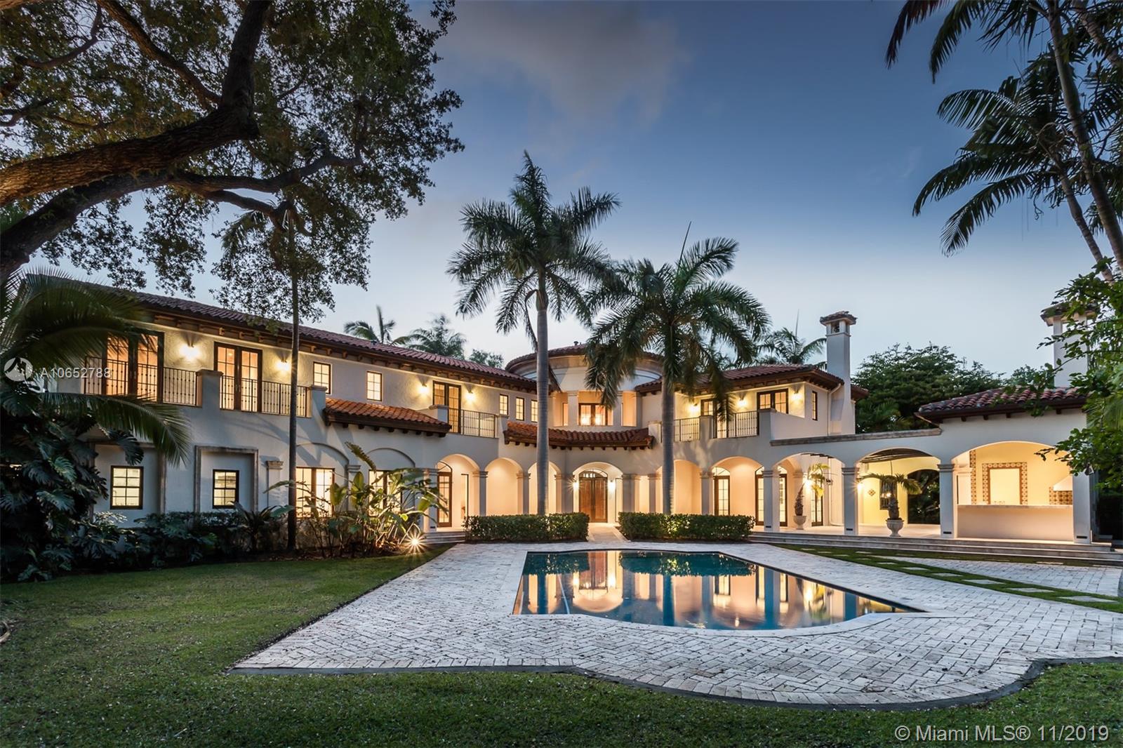 Spectacular gated estate in the prestigious Ponce-Davis area, with beautiful tree-lined streets. Exquisite foyer entrance connects to spacious living areas, including formal living room with fireplace and elegant library. No expenses were spared in this magnificent residence, including an elevator, tremendous gourmet kitchen with finest appliances, large island, Miele coffee system, Wolf 6 gas range, double oven and oversized butler's pantry. Sumptuous grand master suite with separate balcony, large sitting area, his and her closets and two beautifully appointed master bathrooms. The home sits on a tropically landscaped lot, and the interior seamlessly blends with an outdoor area which includes a fantastic well-equipped summer kitchen, beautiful pool, full cabana bath and putting green.