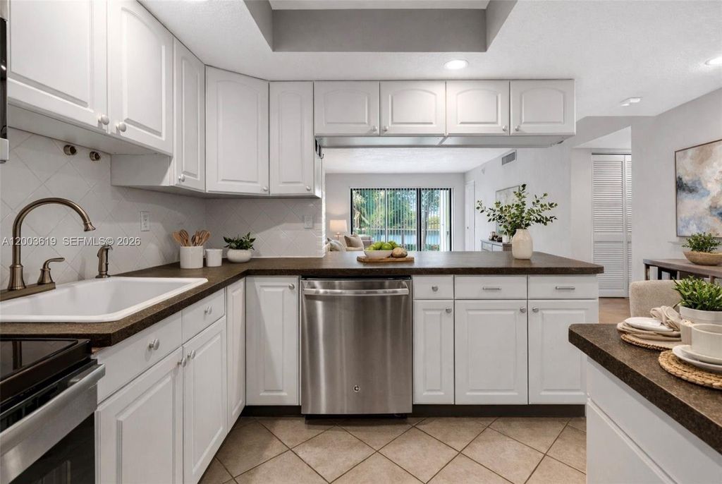 Photo of 2322 S Cypress Bend Dr #311, Pompano Beach, FL 33069 (MLS # A12003619)