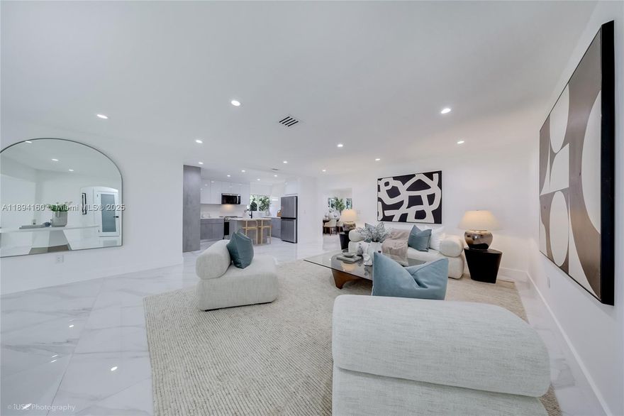 Experience luxury and comfort in this fully renovated designer home in Miami’s sought-after Shorecrest. Offering over 3,100 SF, this 4BR + private office, 2.5BA residence blends sophistication with functionality. The open-concept kitchen features custom cabinetry, premium stainless steel appliances, and a large island flowing into formal living and dining areas — perfect for entertaining. Upstairs, the elegant primary suite offers a walk-in closet, private terrace, and spa-like bath with soaking tub and glass shower. A versatile storage room adds convenience, while professional designer staging highlights every detail. Move-in ready and ideally located minutes from Miami Beach, the Design District, and top dining and shopping. Furniture available for purchase separately.