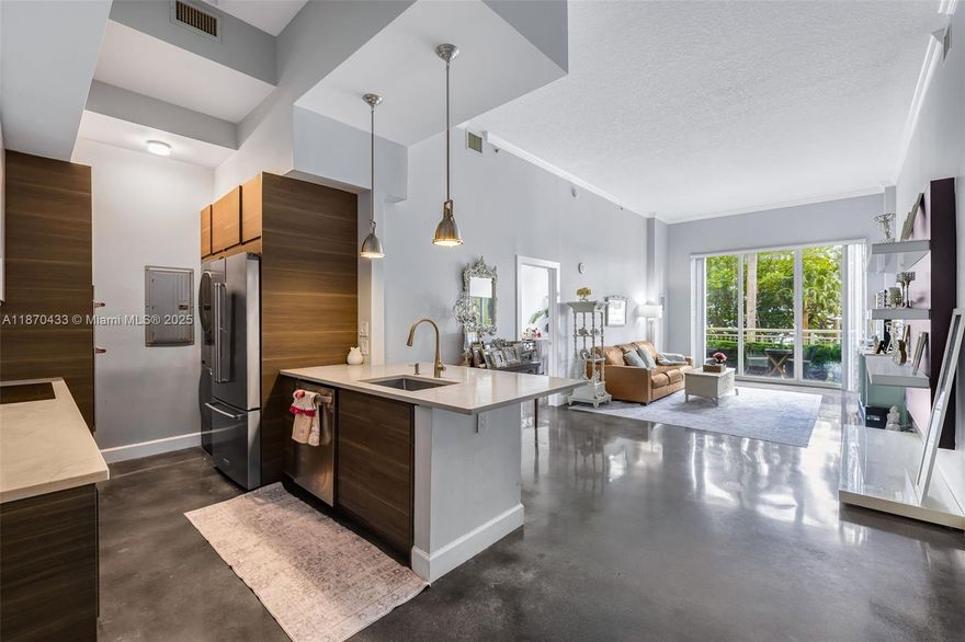 Cité on the Bay’s Unit 114 offers a rare blend of modern design and spacious comfort with soaring 11-foot ceilings that flood the home with natural light and create a true loft-style ambiance. The open layout enhances the sense of volume, while impact-resistant glass doors lead to a private balcony for seamless indoor-outdoor living. Elegant finishes include a gourmet kitchen with granite countertops, stainless steel appliances, and in-unit laundry for convenience. Residents enjoy resort-style amenities: a fitness center, heated pool with sun deck, 24-hour concierge, valet, and secure parking. Located in Edgewater across from Margaret Pace Park, it’s steps from Biscayne Bay and minutes to Wynwood, Midtown, and the Design District.