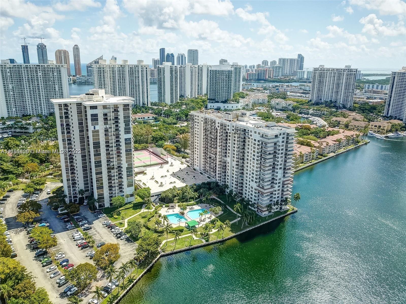 Intracoastal views, 2 bdrm/2 Baths Condo at Biscayne Cove off William Island Blvd. Open balcony to a beautiful sunrise. The condo features an open floor plan, floor-to-ceiling windows, a formal dining room & living area, SS appliances, upgraded wood cabinets, granite countertops, lots of closet space, walk-in closets, and covered parking. Amenities include 2 pools (1 heated), Jacuzzi overlooking Maule Lake, 2 Tennis Courts, Handball/Paddle Ball Court, Party Room, a billiard, Exercise & Party Rooms. 24 Hour Security, Guard Gate. Enjoy all the amenities that Biscayne Cove has to offer. A+ school district. Walking distance to plazas with restaurants, shopping & a child's park. Close to Houses of Worship, Gulfstream, Aventura Mall, and Beaches.