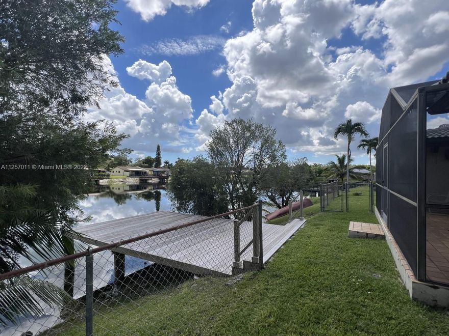 LOCATION! LOCATION! Amazing lake view 1 story 5 bedrooms, 3 full baths, 2 car garage single family home features huge master room with sitting area and 3 spacious walk-in closets. Huge family room, formal living room and dining room area. Kitchen with space for a small dining set. Screened patio overlooking the lake and the new wood dock. California closets in secondary bedrooms. Plenty of linen closets. Dryer and washer inside a big laundry closet. Large lot with a nice landscaping.
No Association. Excellent schools district. Great family oriented neighborhood. Perfect home for a big family. Steps from Miccosukee golf course. Minutes from dining and shopping.