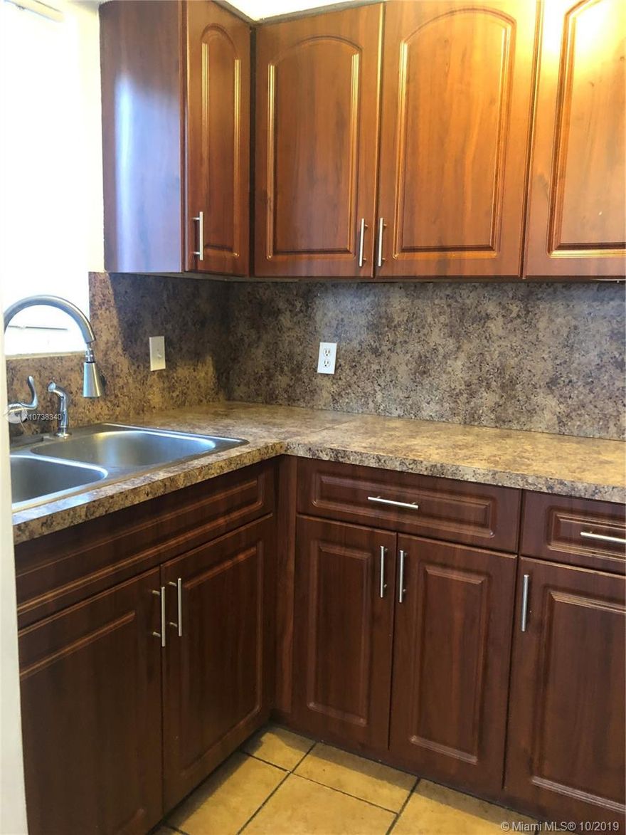 Back on market buyer fail to get financing. Bank appraised at $130,000. 2 Bedroom Townhome, Private Corner Unit, Upgraded Kitchen, Wood Cabinets, Upgraded Bathrooms. Tile & Laminate Flooring, New Fence, Low HOA & Low Property Taxes. OK to Lease. Pet Friendly. Community Pool.  Close to Shops, Restaurants, Highways and North Broward Hospital.