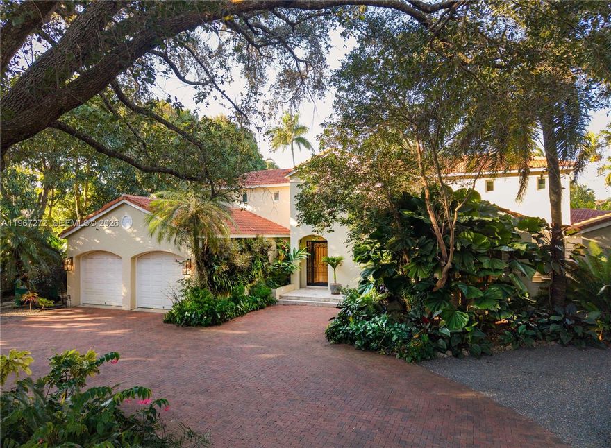 Set in coveted Ponce Davis, this exceptionally maintained estate delivers elevated comfort and peace-of-mind infrastructure. The 6 bedrooms and 6.5 baths home is anchored by it’s ground-floor primary suite complete with a coffee bar, steam room, his-and-hers closets, and a private patio retreat overlooking the salt water pool and lush backyard. The kitchen is a showpiece with top-tier appliances including Sub-Zero, Wolf, Miele, and Viking which flows seamlessly to the family room and easy access to the outdoor patio & summer kitchen. Added peace of mind from the generator supported by 1,000-gallon propane tank. On the near acre property, discover a collector’s tropical garden—a rare sanctuary featuring 100+ varieties of palms and cycads. Complete with a 2-car garage and timeless Ponce Davis appeal, this is a one-of-a-kind home.