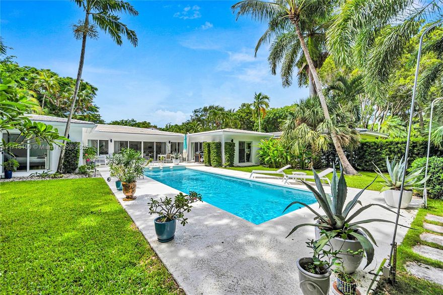 Welcome to this mid-century tropical oasis on a large 12k sf lot in one of Miami's most desirable neighborhoods. This elegant 1-story home features a U-shaped floor plan that maximizes sunlight & privacy for seamless indoor-outdoor living. This unique design offers pool & garden views from nearly every room. Enjoy a sleek modern kitchen w/ new appliances. Luxurious primary suite w/ pool access, walk-in closet & lavish bath w/ separate tub & shower. Spacious junior suite, 1-car gar, dedicated laundry rm, impact windows & doors. Tropical backyard w/ resort-style pool, 80-ft Royal Palms & lush landscaping offering privacy & tranquility. Ideally situated where C. Grove meets C. Gables. Non-flood zone. Bike, walk, or ride your golf cart to top schools, restaurants, bayfront parks & marinas.