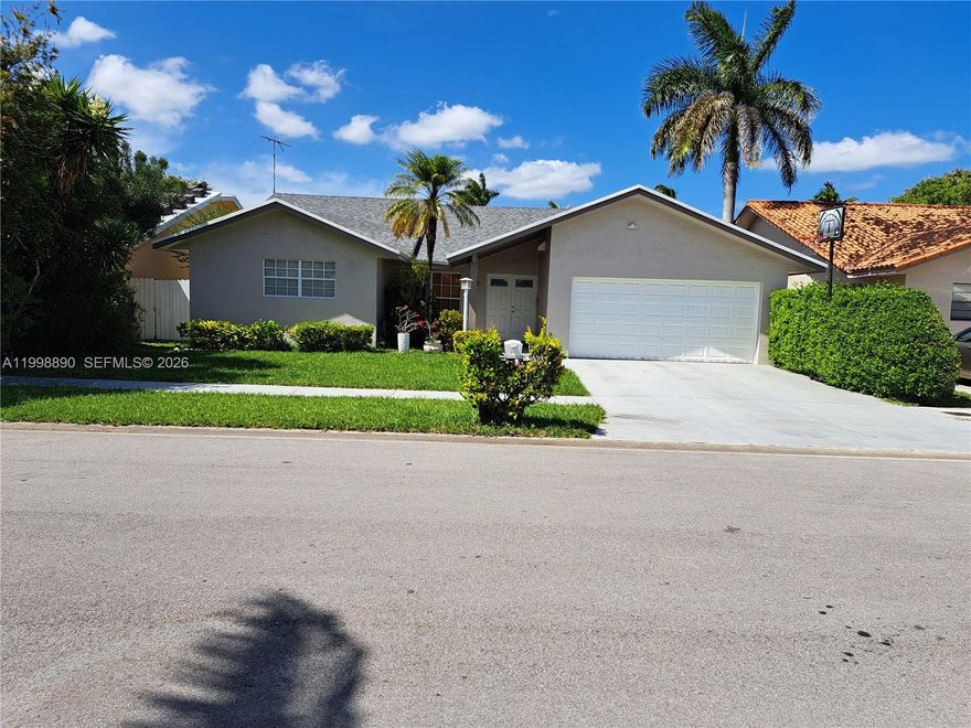 Your dream home awaits! This meticulously maintained Single-Story property shines with a brand new roof, 2-car garage, and NO HOA! Inside, you'll find an exquisite European-Style kitchen with upgraded appliances, custom-designed bathrooms, and sophisticated oversize porcelain tile throughout. Offering 4 bedrooms and 2.5 baths, convenience, plus a generously sized living and open dining area that exceeds tax roll records (permitted). This home provides ample space for comfortable living for a larger household. The master bathroom is designed for relaxation, complete with a Jacuzzi Tub and a separate glass-enclosed shower. The aroma from jasmine trees provides privacy for the outside spacious backyard and patio, creating a serene ambiance, complemented by some hurricane impact windows and an elegant impact front door for enhanced safety. Experience the convenience of suburban living just minutes from top-rated schools, grocery shopping, major hospitals, and main highways. This must-see property won't last long—call for your exclusive showing by appointment only!