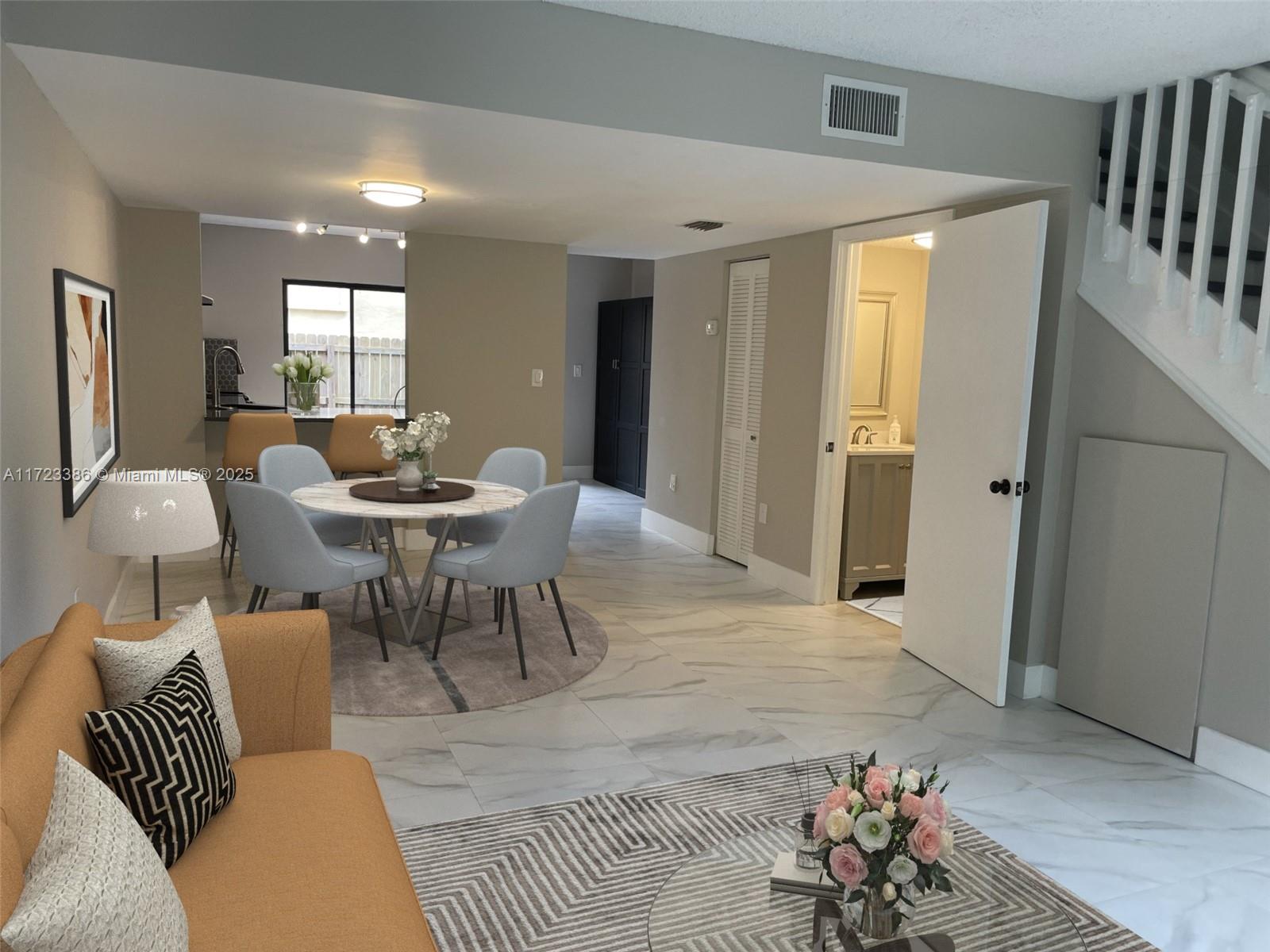 Completely remodeled 2-story townhouse in the highly sought-after gated community of Dadeland Cove. This bright corner unit offers an open floor plan with new porcelain tile flooring throughout. The modern kitchen boasts stainless steel appliances and quartz countertops. Stackable W/D in unit. Bedrooms feature vaulted ceilings, ample closet space, and additional storage in the master. The master balcony overlooks the backyard, perfect for private relaxation and entertaining. Two assigned parking spaces. Hurricane shutters. HOA covers roof, cable/high-speed internet, virtual security guard, pool, and community landscaping. Walking distance to Whole Foods and Target, with easy access to highways, metro-rail, hospitals, dining, shopping, and top schools. Minutes from the heart of Pinecrest.