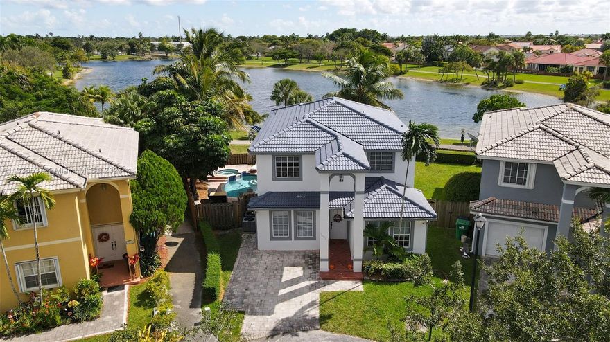 Gorgeous 5 bedroom 3.5 Bath home located in the Hammocks with pool and jacuzzi and spectacular lake view. Completely remodeled