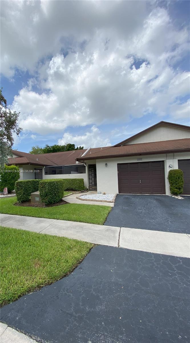 This beautifully updated 2 bd 2 bath villa w/1 car garage blends comfort and elegance. Flex space/office/den with built-ins. Property features include private covered front courtyard and rear patio, vaulted ceilings, sky lights, recessed lighting, plantation shutters, and wood-look tile flooring throughout (surplus tile included). This modern U-shaped kitchen offers a peninsula with counter seating, rich wood cabinetry, quartz surfaces, granite backsplash, and SS appliances including a deep farmhouse sink. Both bathrooms have been beautifully renovated. Roof 2006; AC 2018; water heater 2019; Community amenities include a pool, tennis, and clubhouse, with Publix, dining, and highways just minutes away. HOA requires minimum 700 credit score.