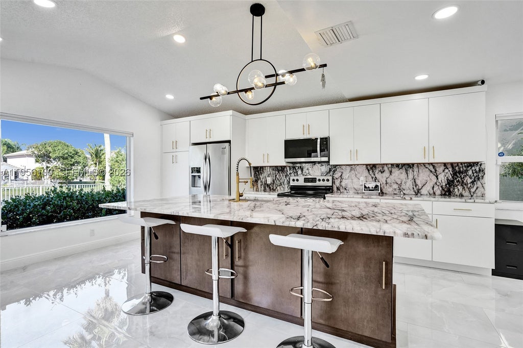 Photo of 5380 NW 117th Ave, Coral Springs, FL 33076 (MLS # A11956199)