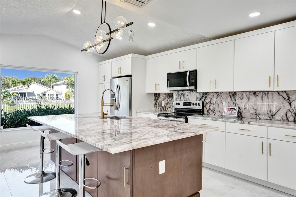 Photo of 5380 NW 117th Ave, Coral Springs, FL 33076 (MLS # A11956199)