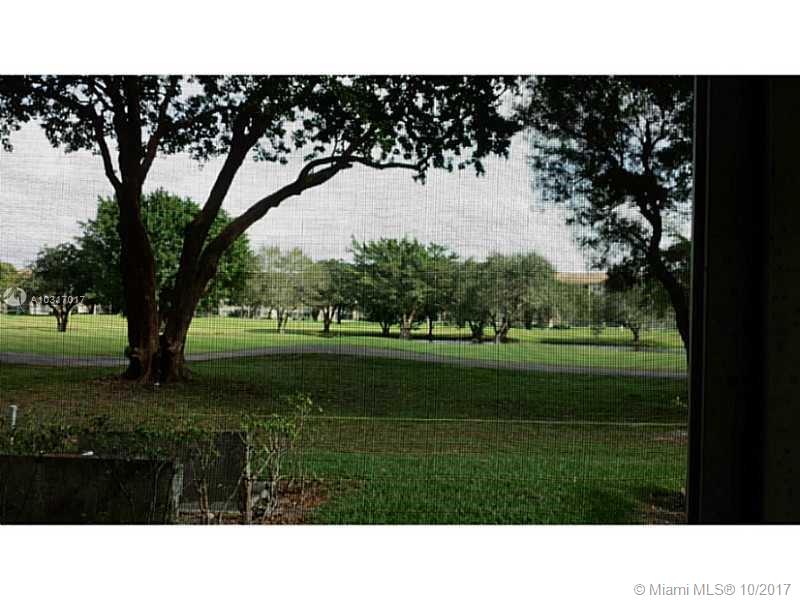 Fabulous golf view! Desirable 1st floor, 2 bedrooms with 1.5 bathrooms. screened patio condo. Within walking distance to clubhouse, health club, pools, gyms, restaurant, cafeteria. Enjoy all the amenities and the privileges of Century Village. Courtesy transportation. Close to shopping, restaurants and major highways.- Association claims 55 Plus.