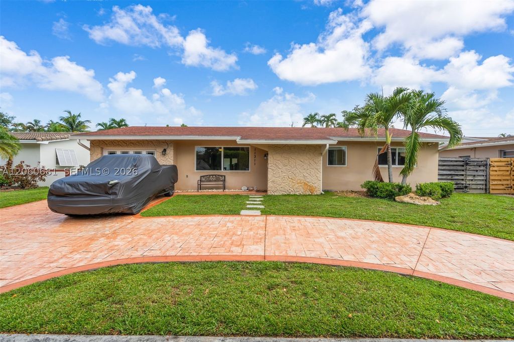 Photo of 11311 NW 23rd St, Pembroke Pines, FL 33026 (MLS # A12060681)