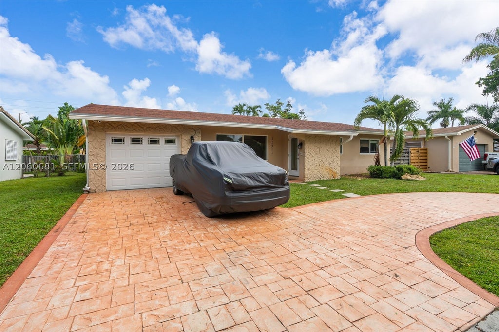 Photo of 11311 NW 23rd St, Pembroke Pines, FL 33026 (MLS # A12060681)