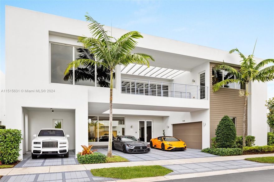 Located in Doral's prestigious Modern 75, the property at 10286 NW 75th Ter is a symphony of luxury and modern design. This 6-bed, 7-bath masterpiece boasts an open-concept living space with top-tier finishes. The chef's kitchen, with premium appliances and custom cabinetry, seamlessly flows into a vibrant outdoor area, featuring a summer kitchen ideal for entertaining. Each bedroom is a private retreat, especially the master suite with its spa-like bath and bespoke closet. Exclusive community amenities like a fitness center and clubhouse enrich the living experience, making this home a true emblem of sophistication.