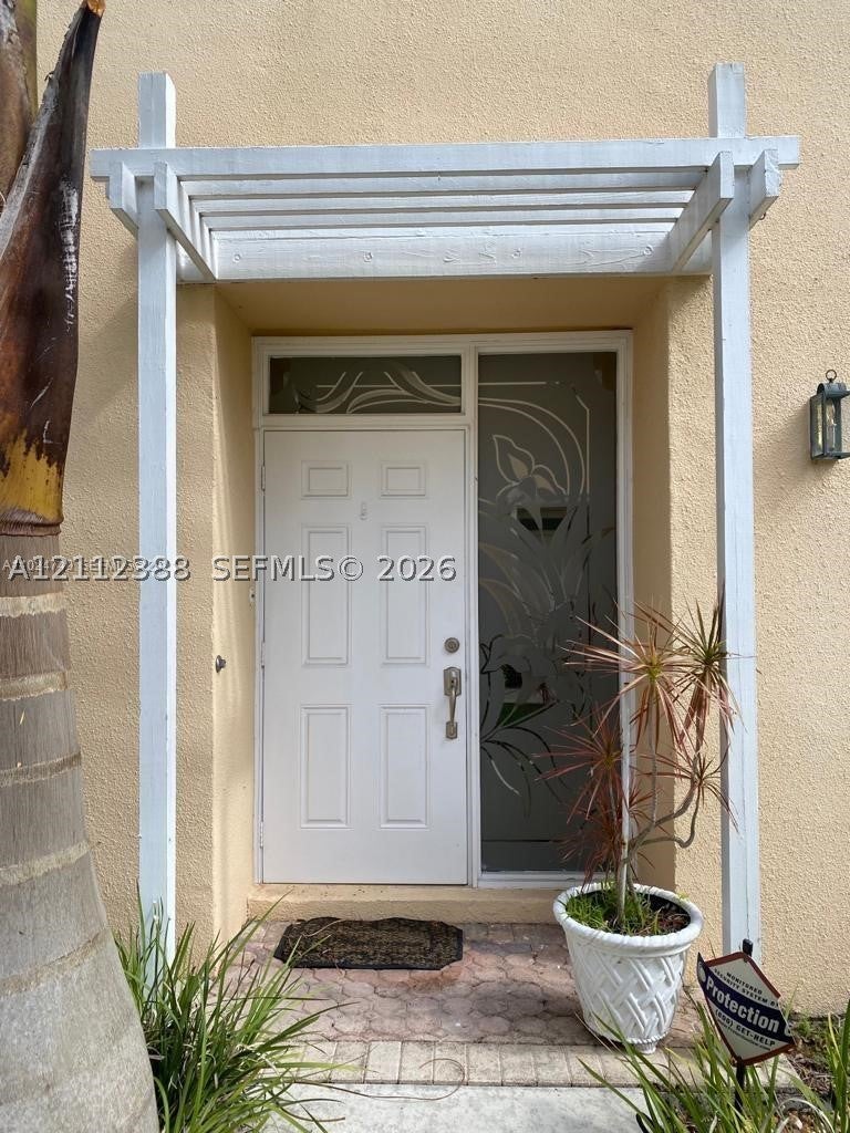 Photo of 9766 Royal Palm Blvd #19, Coral Springs, FL 33065 (MLS # A12112388)