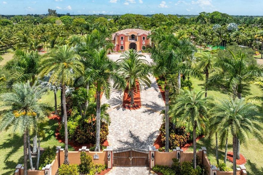 One-of-a-kind 6BD/5BA/2HB Mediterranean Redland Estate on 10 pristine acres on Redland Country Club golf course. Custom-built compound w/ 16,219 total sq ft of unparalleled luxury & functionality. Swimmable grotto w/ 10-foot cascading waterfalls, beach, & world renowned landscaping by Jungles B's Ben Bistrong. Entertainers kitchen w/ built-in hibachi grill, butler’s pantry & breakfast nook. Crestron smart home system, impact windows, a 5-car garage, & a temperature-controlled 800-bottle wine room. In-laws/guest suite, summer kitchen, large gym, media room w/ full bar, endless storage: supply room, tackle room, & walk-in closets throughout. Ag tax benefits w/ palm tree farm. Near Redland’s best: wineries, orchid farms, fruit stands, & private airport. Short drive to Keys & MIA Airport.