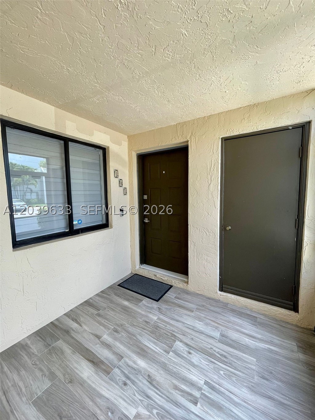 Photo of 16461 Blatt Blvd #103, Weston, FL 33326 (MLS # A12039633)