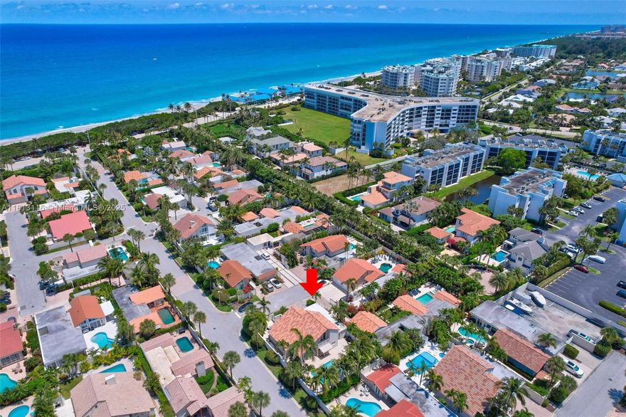 Beautifully expanded & thoughtfully upgraded home just steps from the beach in Jupiter's gated community of Ocean Walk. This 3-bedroom, 3-bath residence offers over 2,260 sq ft under air & features a private saltwater pool, impact-rated windows and doors, and stunning hand-scraped European white oak floors throughout. Extensively renovated in 2013 with structural, mechanical, and designer upgrades including a reconfigured entry, upgraded electrical & copper plumbing systems & a fully sound-insulated interior. In 2019, the dual-zone HVAC system was replaced & now features 2024 HEPA filtration & 2024 200 amp electric panel. The kitchen includes custom shaker cabinetry, granite countertops, and Bosch/GE Monogram appliances. Luxurious primary bath features trending Pistachio marble vanities