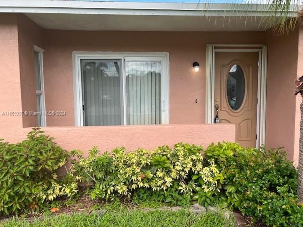 Photo of 9771 NW 23rd Ct, Coral Springs, FL 33065 (MLS # A11669397)