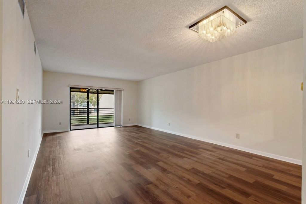 Photo of 4965 E Sabal Palm Blvd #207, Tamarac, FL 33319 (MLS # A11984250)