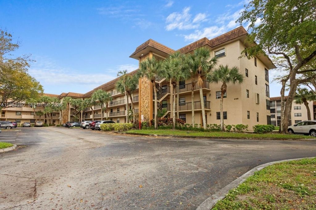 Photo of 4965 E Sabal Palm Blvd #207, Tamarac, FL 33319 (MLS # A11984250)