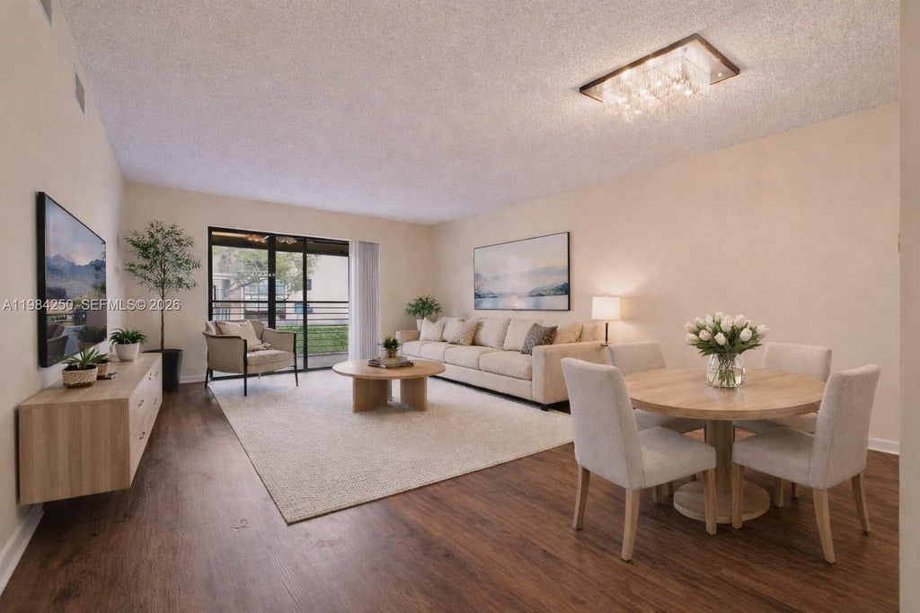 Photo of 4965 E Sabal Palm Blvd #207, Tamarac, FL 33319 (MLS # A11984250)