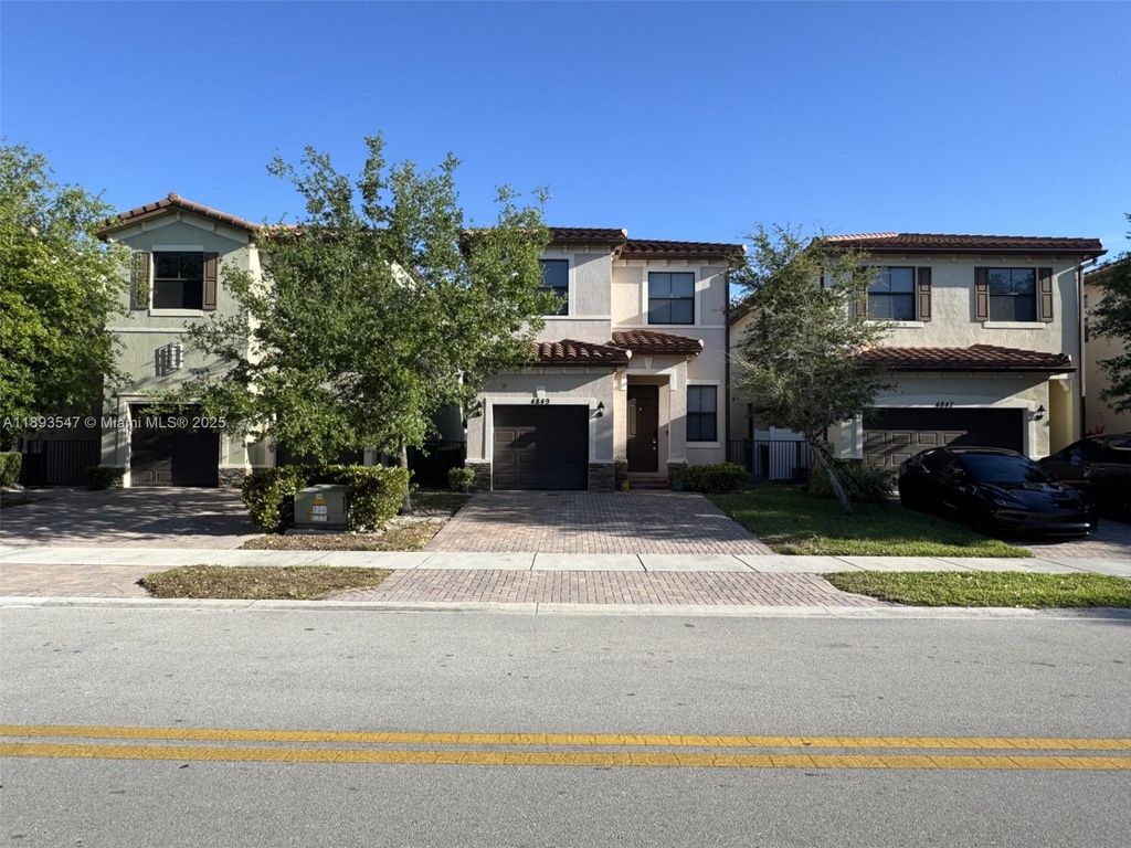 Photo of 4849 NW 57th Ct, Tamarac, FL 33319 (MLS # A11893547)