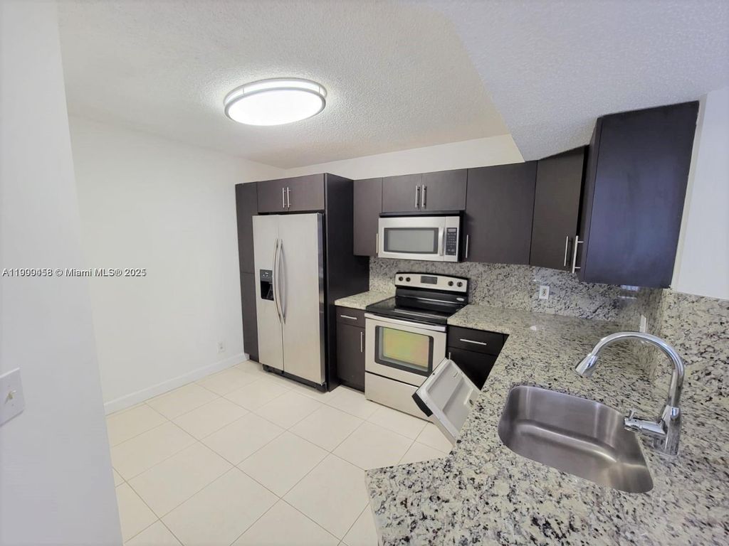 Photo of 8821 Wiles Rd #204, Coral Springs, FL 33067 (MLS # A11900458)