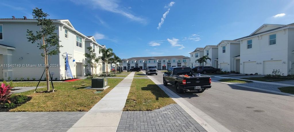 Photo of 855 SE Grovebush Ln, Port Saint Lucie, FL 34984 (MLS # A11540749)