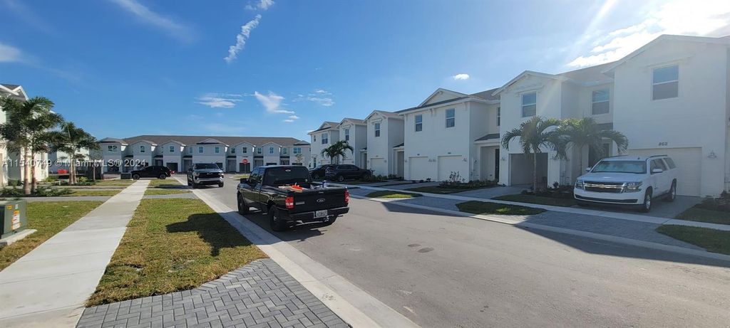 Photo of 855 SE Grovebush Ln, Port Saint Lucie, FL 34984 (MLS # A11540749)