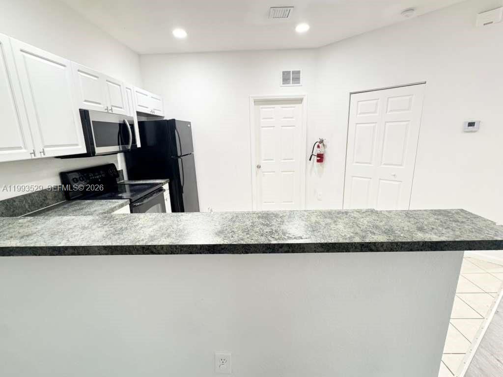 Photo of 1953 Freeport Ln #1953, Riviera Beach, FL 33404 (MLS # A11993529)