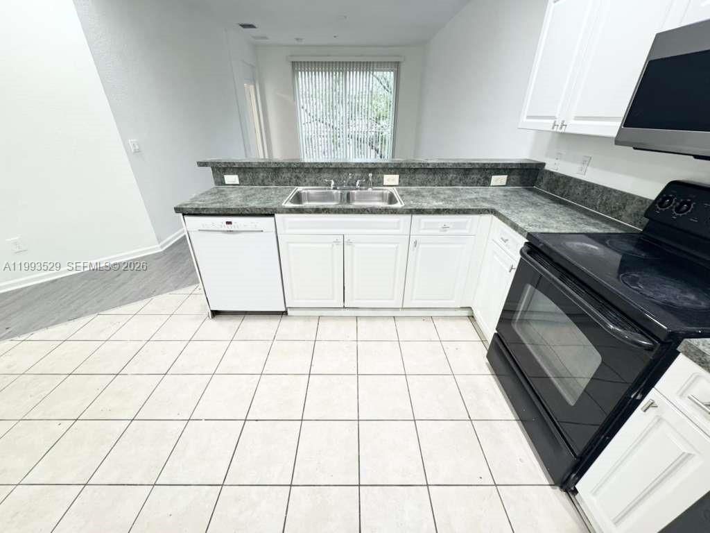 Photo of 1953 Freeport Ln #1953, Riviera Beach, FL 33404 (MLS # A11993529)