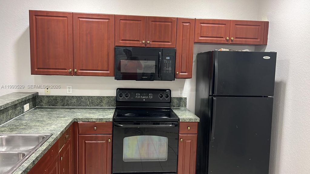 Photo of 1953 Freeport Ln #1953, Riviera Beach, FL 33404 (MLS # A11993529)