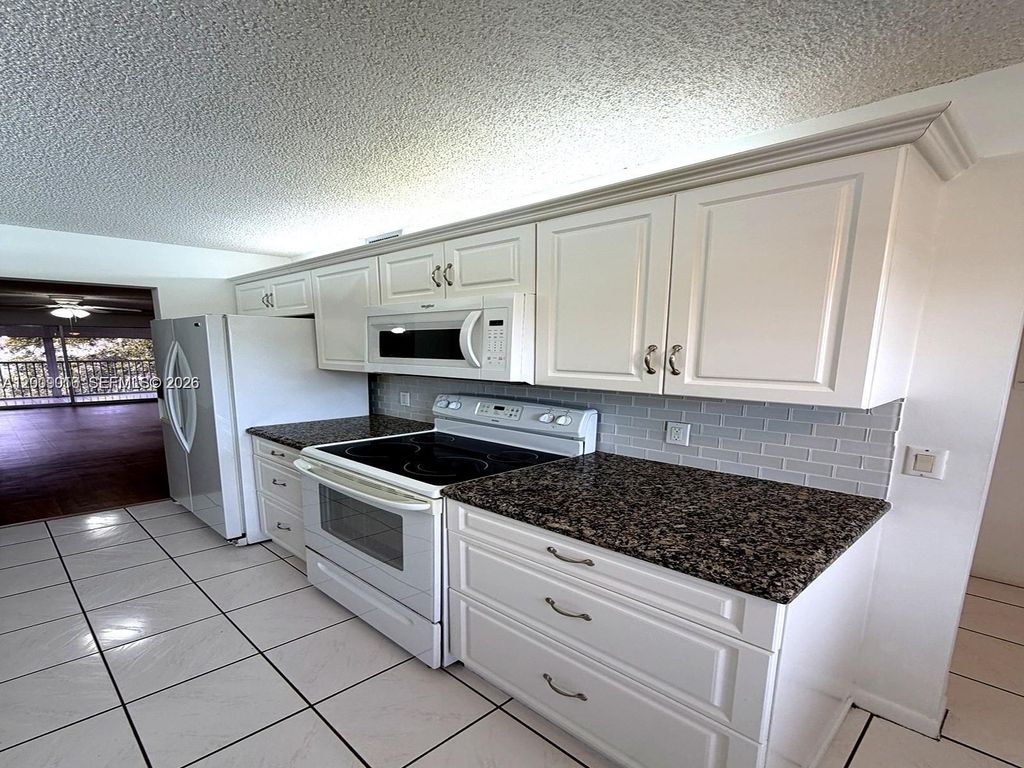 Photo of 1400 SW 124th Ter #402Q, Pembroke Pines, FL 33027 (MLS # A12009016)