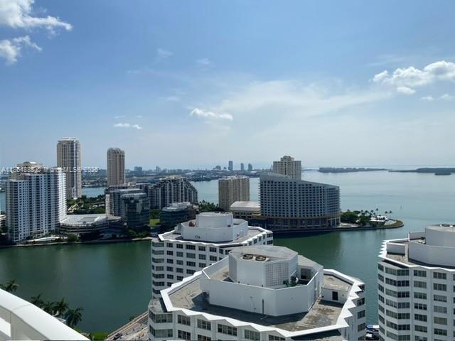 Available as a 3 month rental- perfect for snowbirds seeking a warm-weather retreat. DEC/JAN/FEB please call/text agent to discuss dates.
Stunning Furnished 2bd/2.5ba condo with breathtaking water views. Floor to ceiling windows illuminate the open-concept living and dining areas designed for both entertaining and everyday comfort. The pristine kitchen provides ample storage and counter space, blending functionality with timeless style. Wrap around balcony perfect for enjoying sunrise to sunset panoramas.
The spacious primary suite includes a spa-inspired bathroom and walking closet and stunning water and city views. The second bedroom is ample and features its own walk-in closet, ideal for guests or a home office.
Powder room/ washer and dryer.