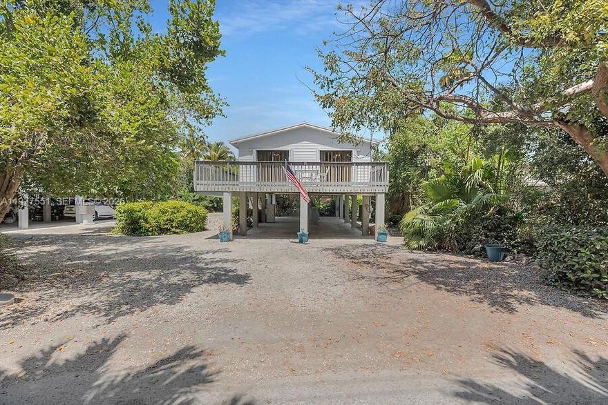 Seller MOTIVATED!!! 103 Stirrup Key Woods Road - A Hidden Gem in the Heart of Marathon! Nestled among lush native trees and tropical vegetation, this charming 3-bedroom, 2-bath single-family home offers the perfect blend of privacy, warmth, and island living. Lovingly maintained by the same owner for over 30 years, this stilted home sits on an oversized lot, offering ample space and endless potential—including room for a pool. Step inside and feel right at home. The interior is cozy and inviting, with natural light pouring in through large windows that showcase the surrounding greenery. The home features a washer and dryer for your convenience, and the layout is both functional and comfortable, ideal for full-time living or a peaceful vacation getaway. Recent updates include a durable metal roof installed in 2017, providing peace of mind and modern appeal. Insurance information is available upon request. Located in a well-loved neighborhood, this property is centrally positioned—just minutes from Marathon's best dining, shopping, beaches, and marinas. Whether you're looking to relax in a serene setting or enjoy the vibrant Keys lifestyle, this property is a rare find with the perfect balance of seclusion and accessibility Don't miss your chance to own a beautiful slice of paradise at 103 Stirrup Key Woods Road!