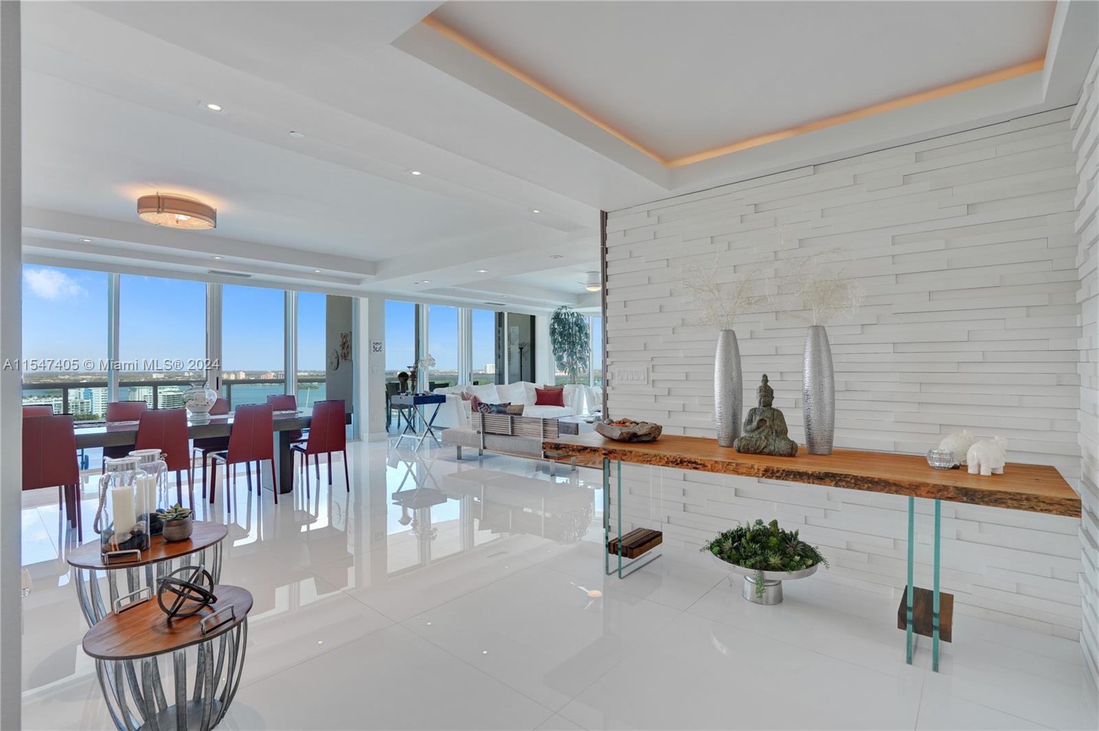 The wrap-around balcony allows a spectacular view of the Ocean, the Bay, and the City with incredible Sunset. Completely remodeled, upgraded, and modernized unit with individual foyer entrance, spacious and bright living room, dining room, and kitchen with breakfast area. Large laundry & service area with full bath and convertible bed. Master bedroom with walk-in closets for him and her, office area and sea view. 2 other full suites with balcony access and 2 queen beds, each. Top class amenities: SPA, Pool, Beach Service, Tennis court & Restaurant. This well-kept penthouse is a vacation home with very little use and it's located in one of the most luxurious buildings in Bal Harbour.