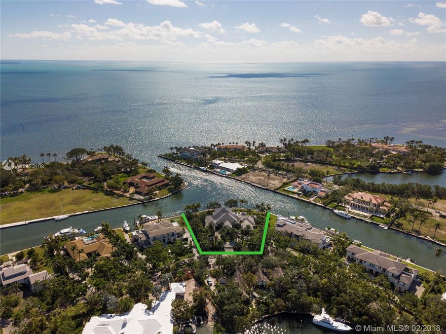 Premiere location within Gables Estates. Boater's dream on this acre+ point lot with expansive water views directly to the Bay. 270' of water frontage on wide lagoon with 52' dock and plenty of room for all your water toys! House features 12k+ SF, 5 beds/6.5 baths including enormous master bedroom and bathroom, grand foyer, massive living room, media room, 2 beautiful offices, chef's kitchen and butler pantry, breakfast room, craft room, wine cellar, generator, 4 car garage and more. Best opportunity in Gables Estates.