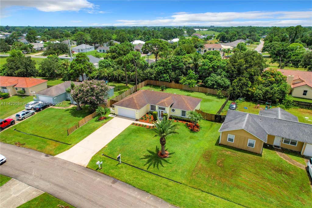 Photo of 758 SW Parker Ave, Port Saint Lucie, FL 34953 (MLS # A11423081)