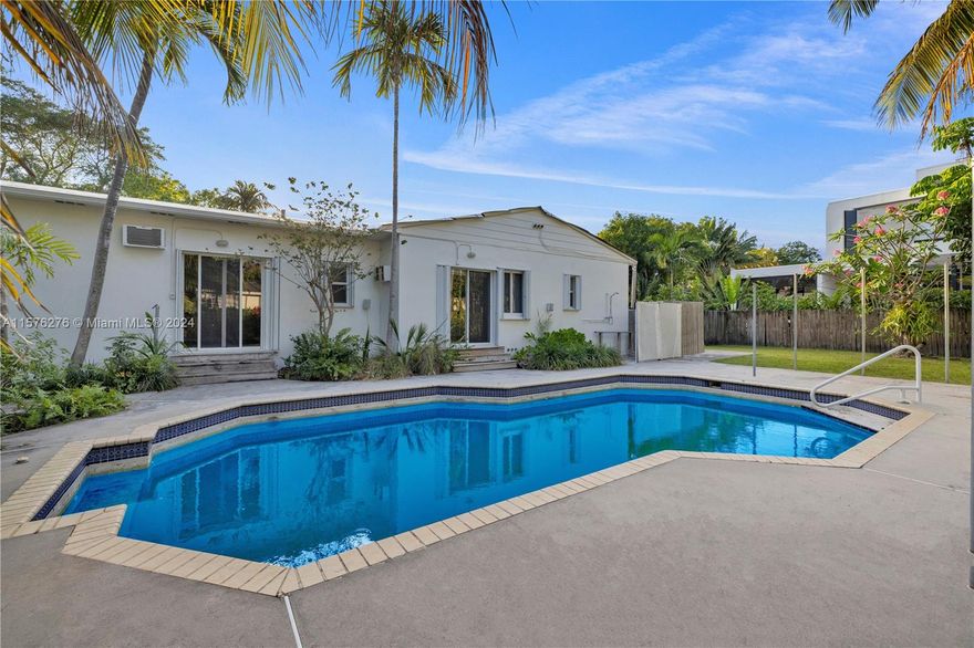 Opportunity knocks in beautiful Belle Meade! If you’re a visionary or investor looking to renovate or build one or two new homes, this may be for you. Located in exclusive, security guard gated Belle Meade in the heart of Miami’s vibrant MiMo District, the current four bedroom-three bath generous home with a brand new roof is expansive, with ~3,300 SF of living space; with the right design vision, it could be a masterpiece (Seller has renovation plans for inspiration). Situated on a huge 15,930 sf "mega-lot" with 135’ of frontage, allowing for one or two new luxe homes, depending on your vision. Endless opportunities… Quite the opportunity!