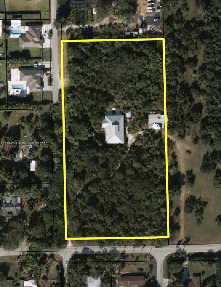 Beautiful 4-bedroom, 2-bath home on 4.73 agricultural-exempt acres. Features hardwood floors throughout, hurricane-impact windows and doors, and an open floor plan filled with natural light from skylights. The huge kitchen offers custom cabinets and abundant storage. Enjoy a cozy fireplace, sparkling pool, and detached 2-car garage with car lift. The master suite includes a new tub and shower plus two walk-in closets. Solid concrete construction with reinforced metal beams, metal roof (2008), and two newer A/C units.