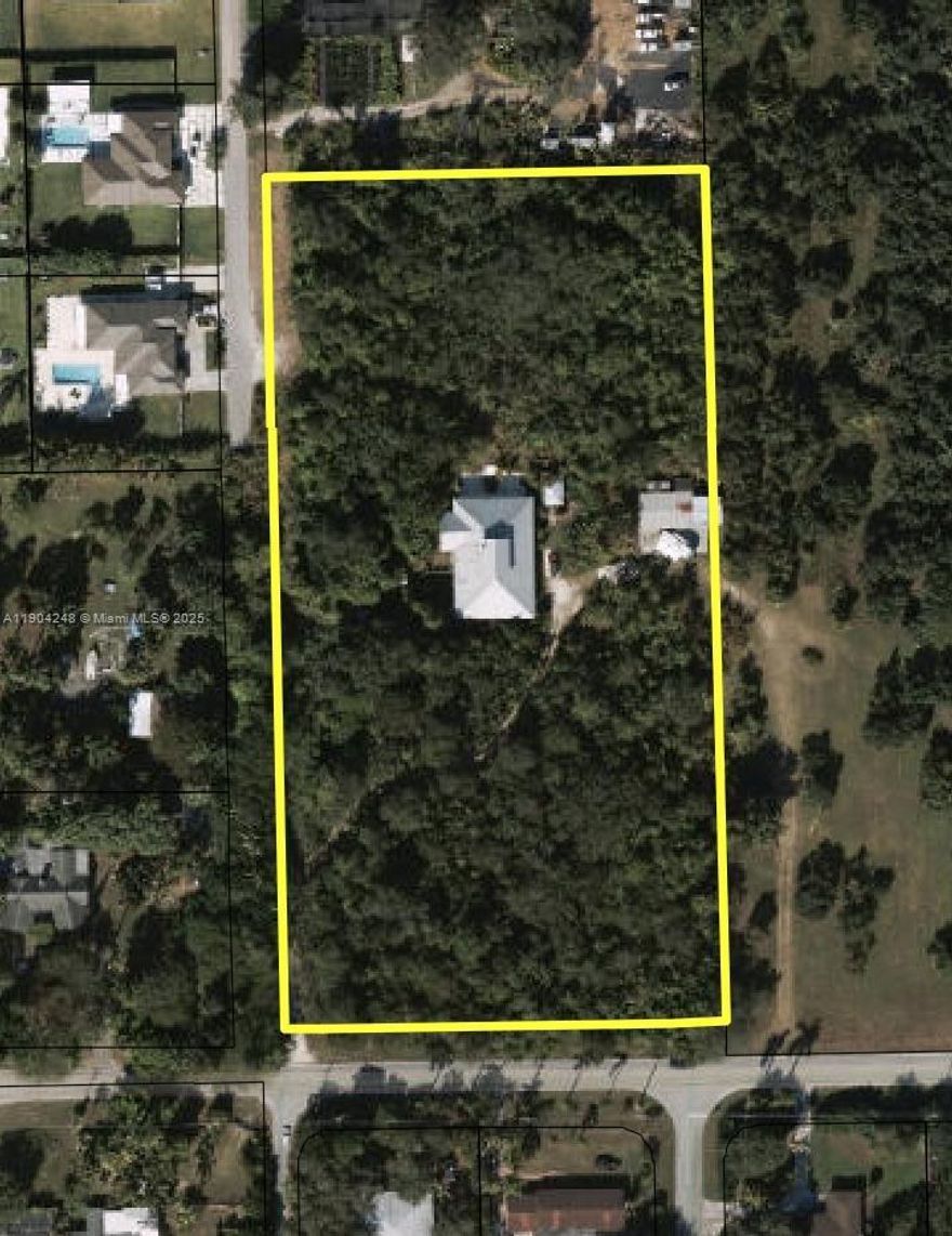 Beautiful 4-bedroom, 2-bath home on 4.73 agricultural-exempt acres with 4,250 sq ft of living space. Features hardwood floors throughout, hurricane-impact windows and doors, and an open floor plan filled with natural light from skylights. The huge kitchen offers custom cabinets and abundant storage. Enjoy a cozy fireplace, sparkling pool, and detached 2-car garage with car lift. The master suite includes a new tub and shower plus two walk-in closets. Solid concrete construction with reinforced metal beams, metal roof (2008), and two newer A/C units.