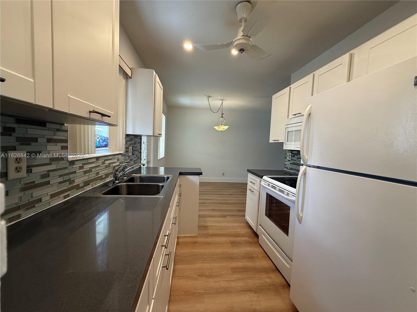 Move right into this beautifully remodeled unit! It boasts brand new flooring and fresh paint, offering a clean, modern feel. You'll love the convenience of being just 10 minutes from the beach, walking distance to a vibrant array of restaurants and entertainment, and having easy access to I-95 for effortless commuting. Don't miss out on this fantastic opportunity – call today to schedule a viewing!