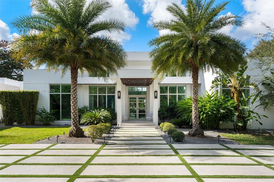 Seller financing available, contact agent for more information. Tucked away on nearly an acre of lush, private grounds along prestigious Old Cutler Road in Pinecrest. Step inside this remarkable oasis to discover high ceilings and high-impact windows throughout. The home features a kitchen with an impressive and modern layout, including Italian cabinetry, Wolf and Sub-Zero appliances, a breakfast area by Veneta Cucine, a wine cellar, and a bar. The open living room offers stunning views of the infinity pool and terrace with a summer kitchen. The serene primary suite overlooks the pool, surrounded by exquisite landscaping, with a spa-inspired bath featuring dual vanities, a soaking tub, and porcelain finishes. Located near elite schools and minutes from Gulliver Preparatory School.